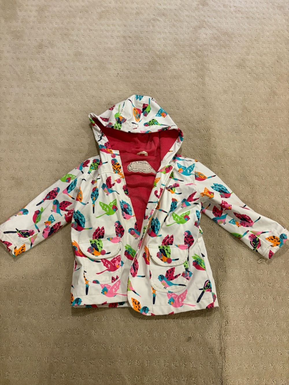 Hatley White Hooded Raincoat with Bright Multi-Colored Bird Print